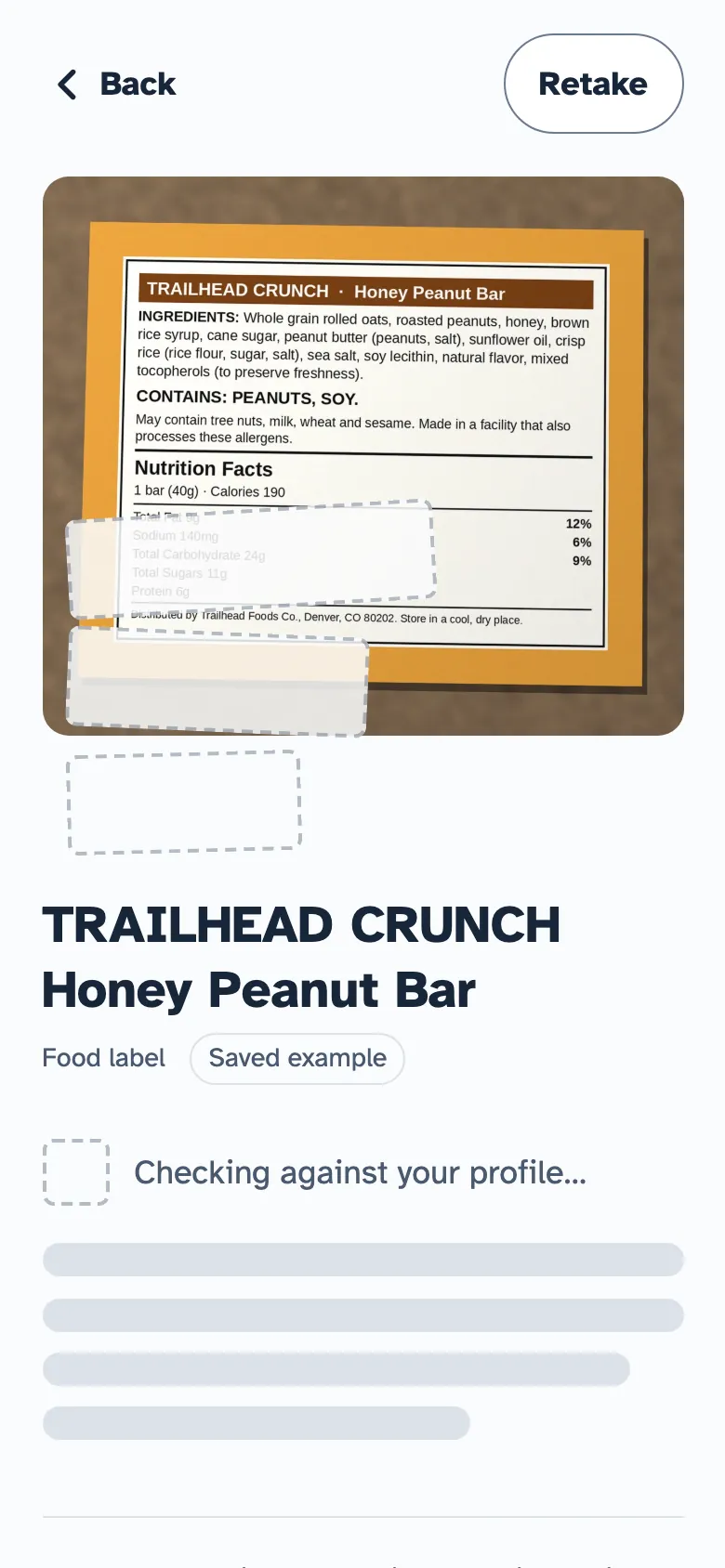 A snack bar photo already named Trailhead Crunch Honey Peanut Bar, with the check against the profile still in progress.